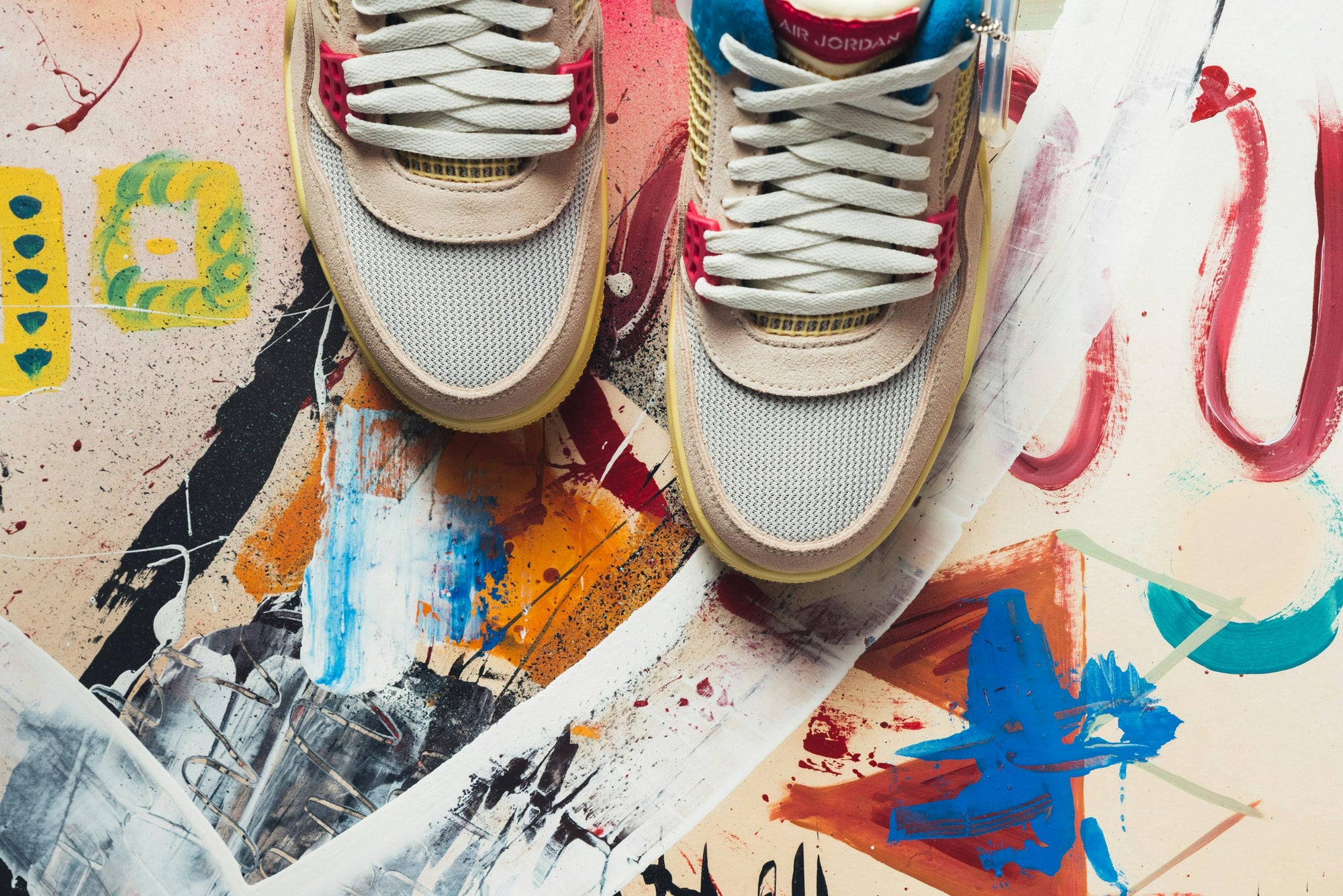 Pair of Nike Air Jordan 4 Retro Union Guava Ice Sneakers · Free Stock Photo